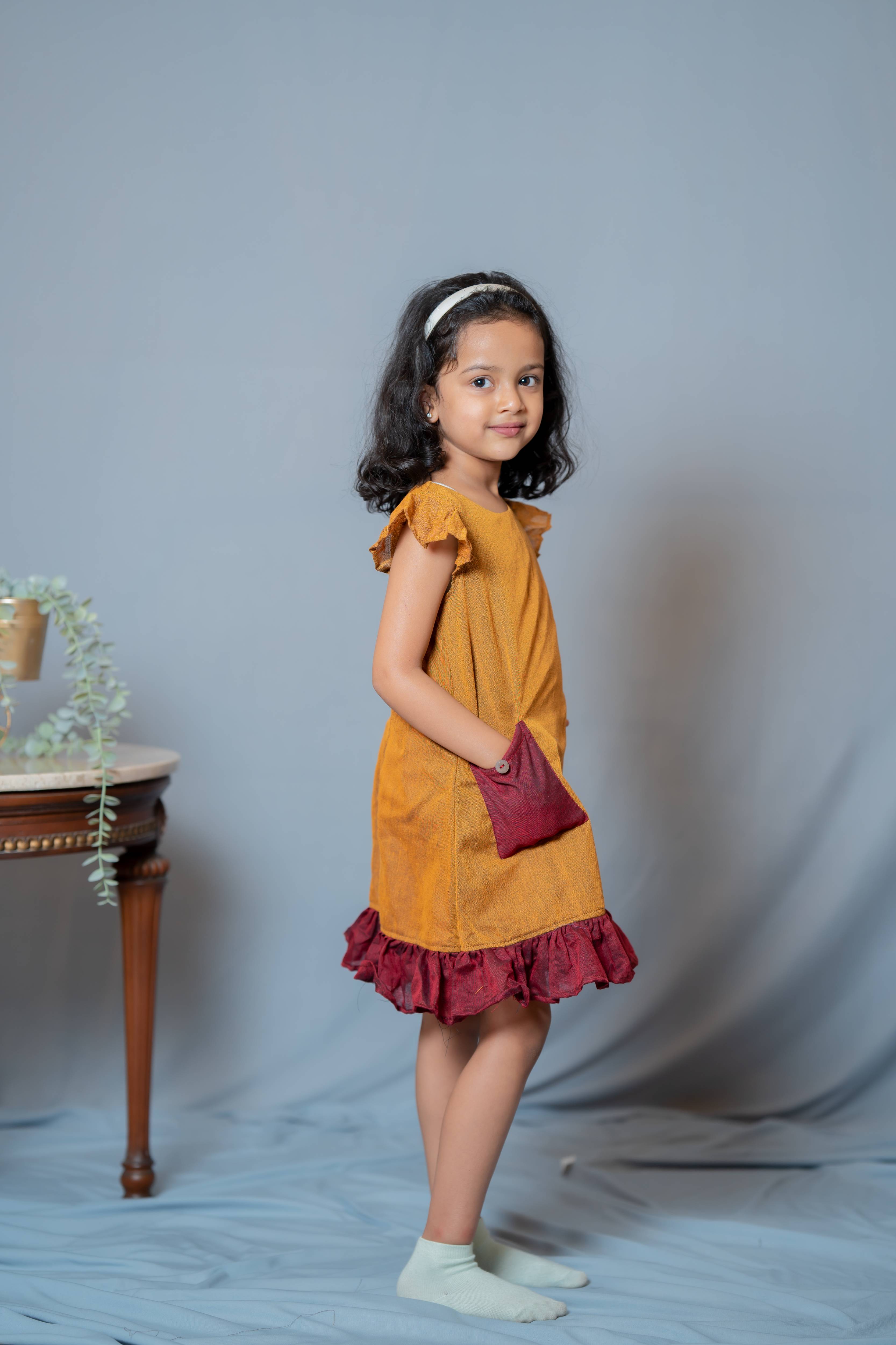 Ritu - Frill-frock in Mustard with red in Khadi fabric