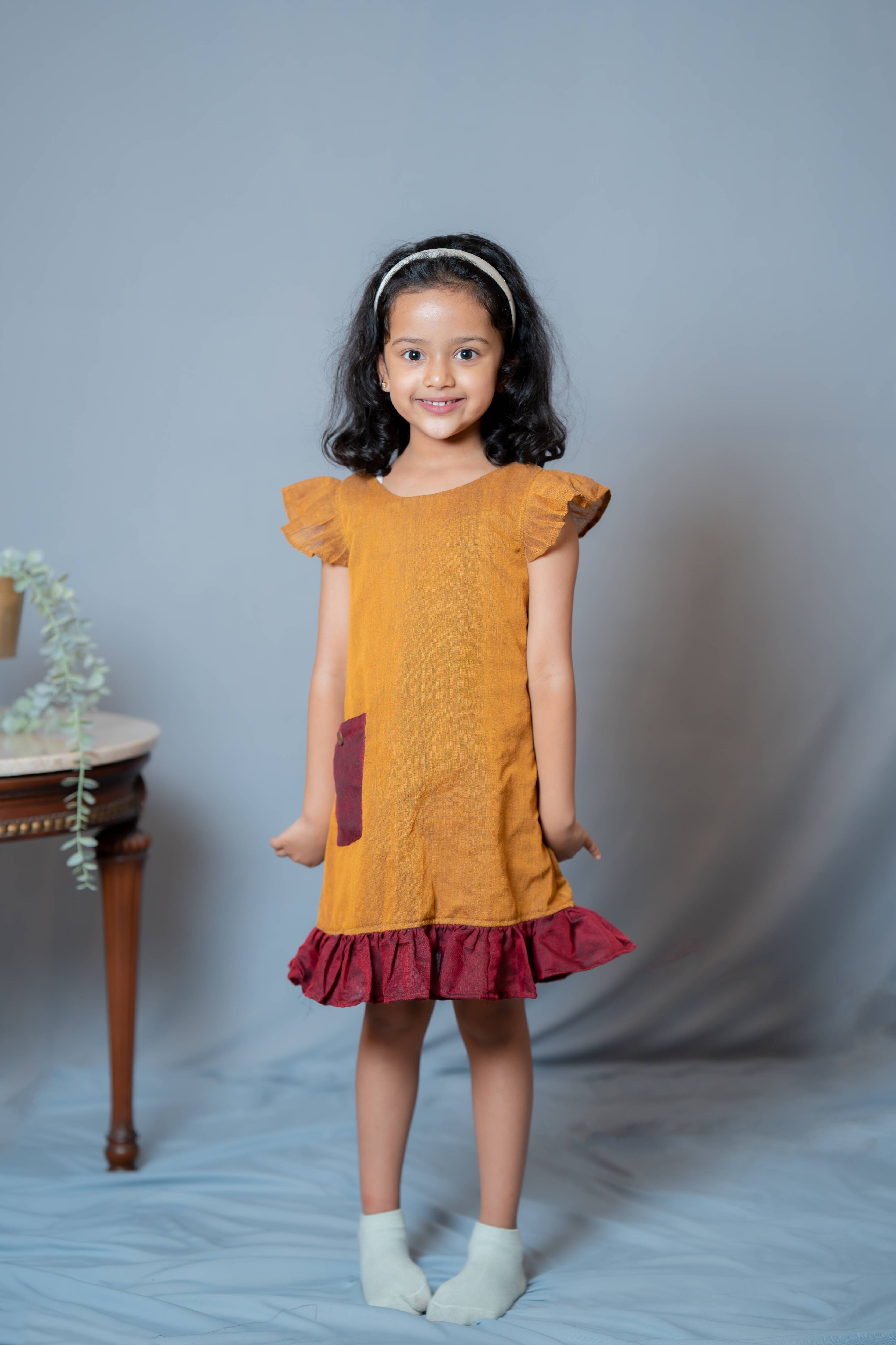 Ritu - Frill-frock in Mustard with red in Khadi fabric