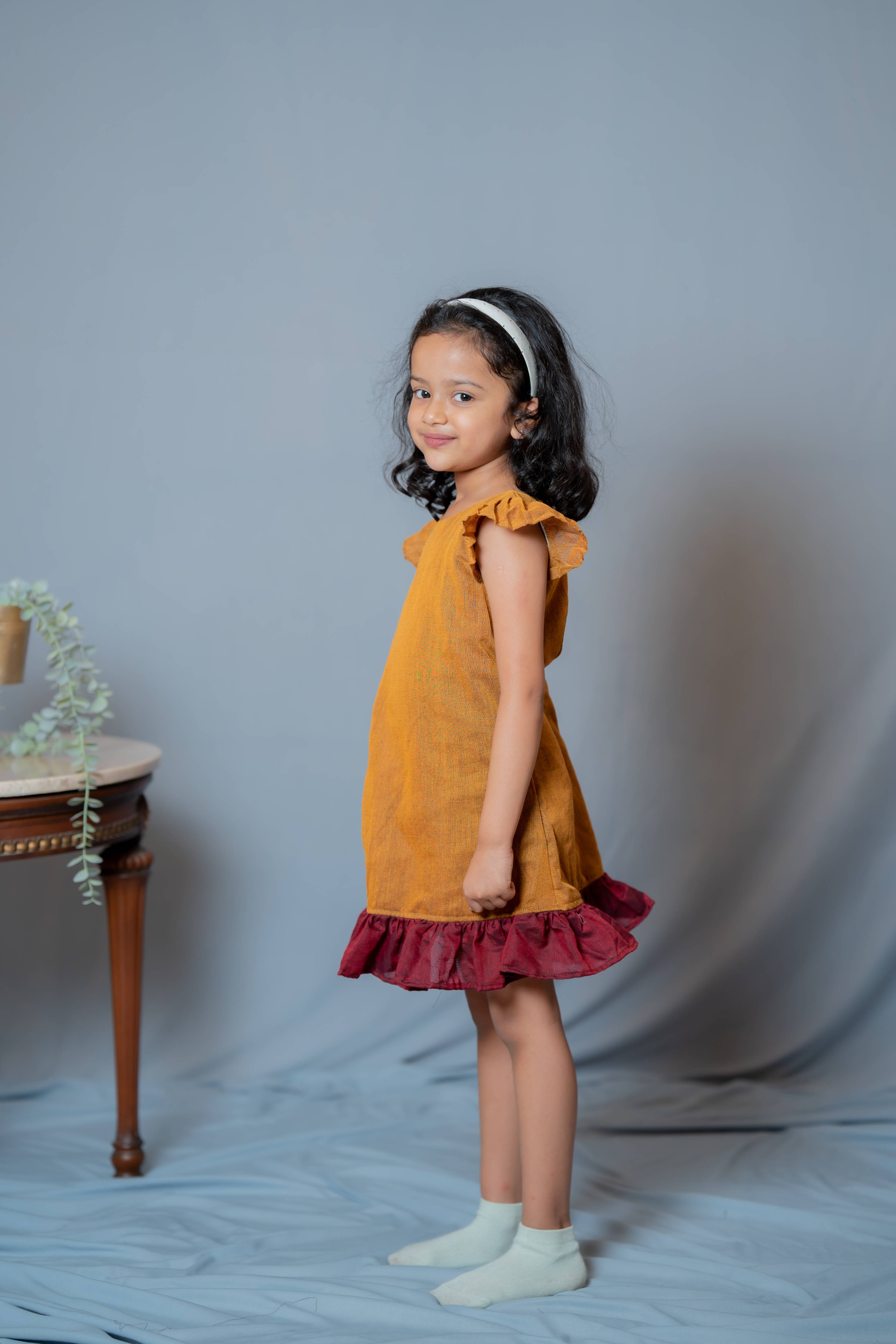 Ritu - Frill-frock in Mustard with red in Khadi fabric